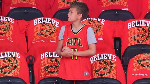A young Trae Young fan takes in the scene at State Farm Arena before Game Six of the Eastern Conference Finals against Milwaukee.   “Curtis Compton / Curtis.Compton@ajc.com”