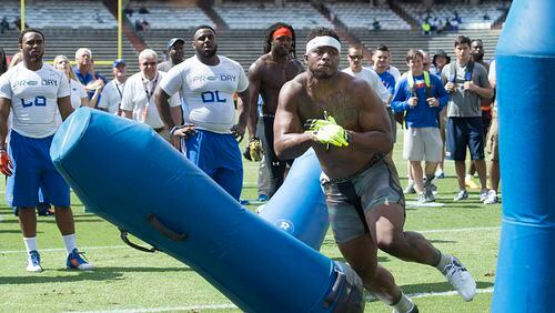Dante Fowler, Jr. knocks down a bag as he runs through drills during the Pro Scout Day at the University of Florida NFL Combine in Gainesville, FL, Tuesday, April, 7, 2015. (AP Photo/Phil Sandlin) Former Florida pass rusher Dante Fowler is one player the Falcons have interest in. (AP photo