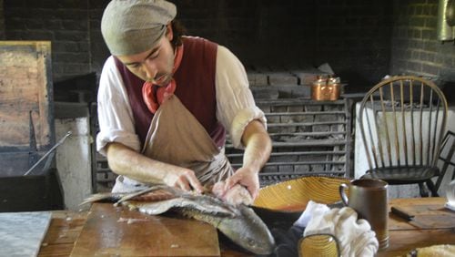 Kitchen staff at the Colonial Williamsburg governor’s palace still prepare food items daily according to period tradition. (Myscha Theriault/TNS)