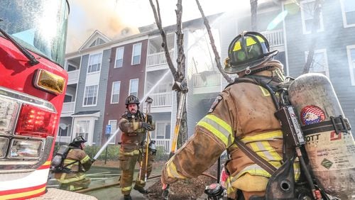 DeKalb County firefighters were on the scene of a massive blaze at The Marq at Brookhaven apartment complex on Fri., Feb. 19, 2016. JOHN SPINK / JSPINK@AJC.COM