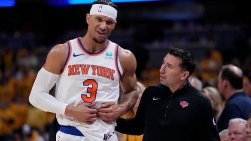 New York Knicks guard Josh Hart (3) reacts after getting injured during the first half of Game 6 against the Indiana Pacers in an NBA basketball second-round playoff series, Friday, May 17, 2024, in Indianapolis. (AP Photo/Michael Conroy)