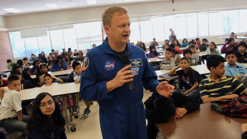 NASA Astronaut and Air Force Col. Eric Boe talks to about 330 sixth grade students about his two-week trip on Discovery that docked with the International Space Station at Sequoyah Middle School Wednesday, May 4, 2011. It was the final mission of Space Shuttle Discovery, launched February 24, 2011, and landing on March 9, 2011. The six-man crew joined the other six-man crew of Expedition 26, who were already aboard the space station. Students also watched an 18-min video about his orbit experience on Flight STS-133.
Vino Wong vwong@ajc.com