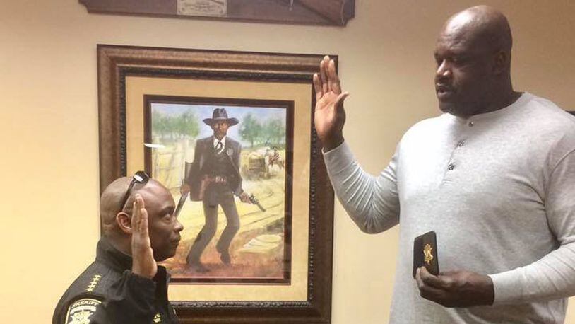 Clayton County Sheriff Victor Hill posted these photos of him swearing in Shaquille O'Neal as a deputy in 2016.