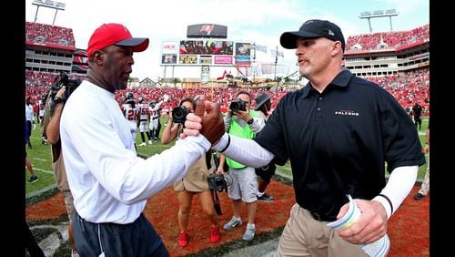 TAMPA, FL - DECEMBER 06: Head coaches Lovie Smith of the Tampa Bay Buccaneers and Dan Quinn of the Atlanta Falcons shake hands after the game at Raymond James Stadium on December 6, 2015 in Tampa, Florida. (Photo by Rob Foldy/Getty Images)