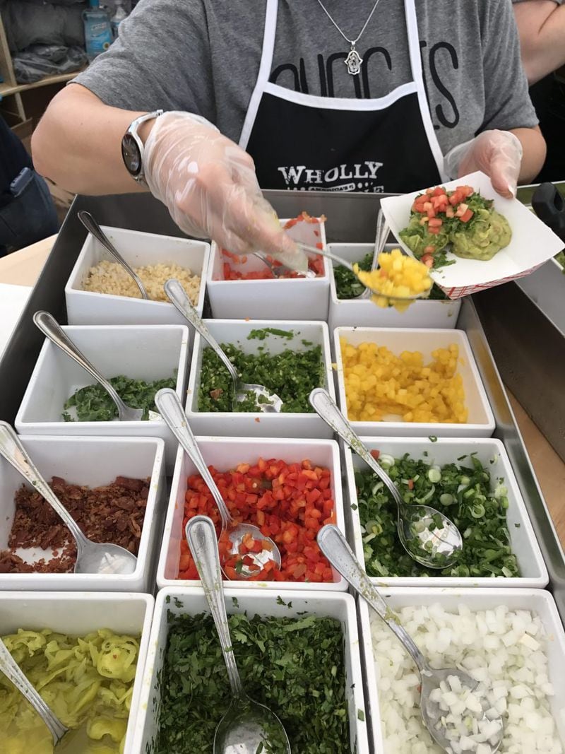  Customize your guacamole at The Guac Stop, which will be at Atlantic Station from June 28 to July 2./Photo courtesy of Wholly Guacamole.