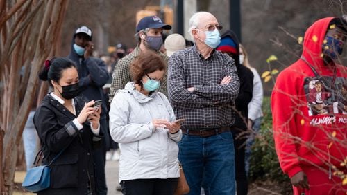 Lynn and Len Sinclair wait in line for Covid testing at the Fulton County Center for Health and Rehabilitation on Tuesday morning. The couple were exposed to the coronavirus through a Christmas guest. Ben Gray for the Atlanta Journal-Constitution