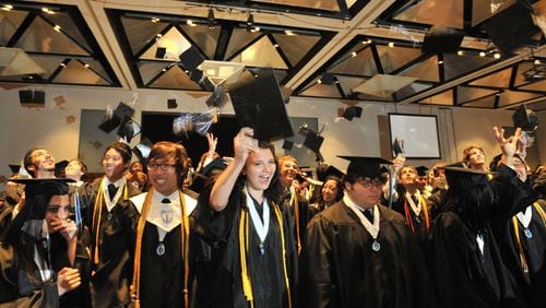 Students of the Gwinnett School of Mathematics, Science and Technology celebrate graduation in this AJC file photo.