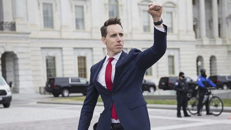 Sen. Josh Hawley, R-Missouri, greets Trump supporters with a raised fist outside the U.S. Capitol on Jan. 6 in a show of solidarity as he arrived for a joint session of Congress to certify Joe Biden's Electoral College victory. A group of Senate Democrats lodged a complaint with the Senate Ethics Committee against Sens. Hawley and Ted Cruz, R-Texas, concerning their efforts to undermine the election, culminating in the violent insurrection. (Associated Press file photo)