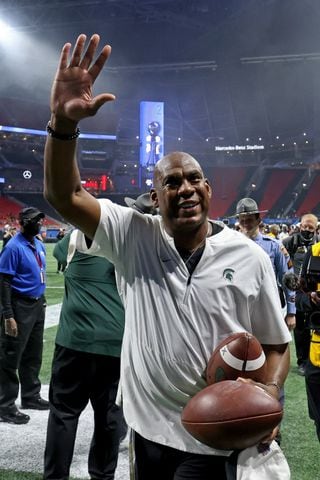 Michigan State Spartans head coach Mel Tucker waves to fans after their 31-21 win against the Pittsburgh Panthers during the Chick-fil-A Peach Bowl at Mercedes-Benz Stadium in Atlanta, Thursday, December 30, 2021. JASON GETZ FOR THE ATLANTA JOURNAL-CONSTITUTION
