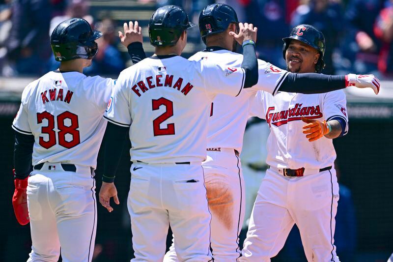 Cleveland Guardians' Jose Ramirez, right, is congratulated by Gabriel Arias (13), Tyler Freeman (2), Steven Kwan (38) after hitting a grand slam off Boston Red Sox starting pitcher Chase Anderson during the second inning of a baseball game, Thursday, April 25, 2024, in Cleveland. (AP Photo/David Dermer)