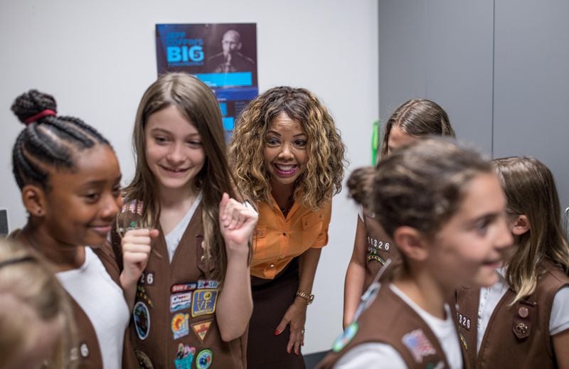 U.S. Rep. Lucy McBath speaks with a group of Girl Scouts before holding a town hall meeting at Dunwoody High School on Saturday, June 8, 2019. (Photo: Branden Camp/Special to the AJC)