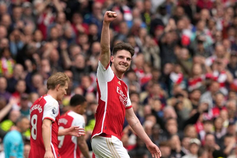 Arsenal's Declan Rice celebrates after scoring his side's third goal during the English Premier League soccer match between Arsenal and Bournemouth at Emirates Stadium in London, England, Saturday, May 4, 2024. (AP Photo/Frank Augstein)