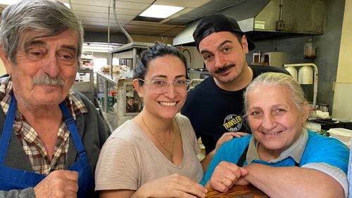 Nick Poulos (from left), Evie Poulos, Ben Poulos and Eleni Poulos are seen in the kitchen at Nick's Food to Go. Bob Townsend for The Atlanta Journal-Constitution