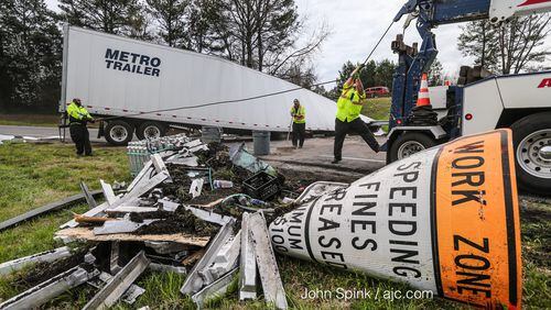 The ramp from I-20 East to I-285 North in Fulton County was blocked for three hours early Monday. JOHN SPINK / JSPINK@AJC.COM