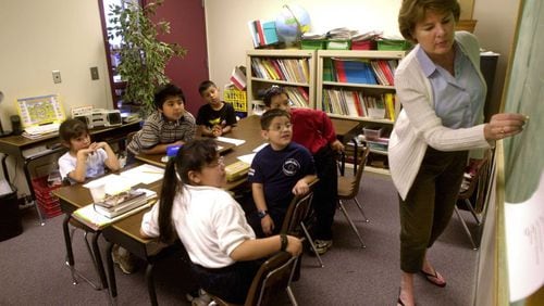 From 2001: Dell Boettger, right, teaches an ESOL class at Park Street Elementary in what was once a teacher conference room. There were many cramped classrooms that year, whern the school had more than 800 students.