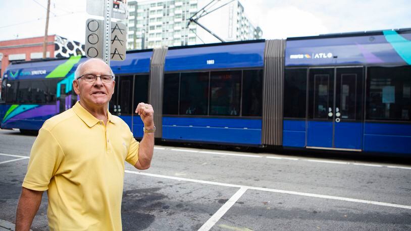 Fred Duncan, an Old Fourth Ward resident, watches the Atlanta Streetcar pass on Nov. 7. Duncan opposes a proposed expansion of the streetcar to Ponce City Market. CHRISTINA MATACOTTA FOR THE ATLANTA JOURNAL-CONSTITUTION.