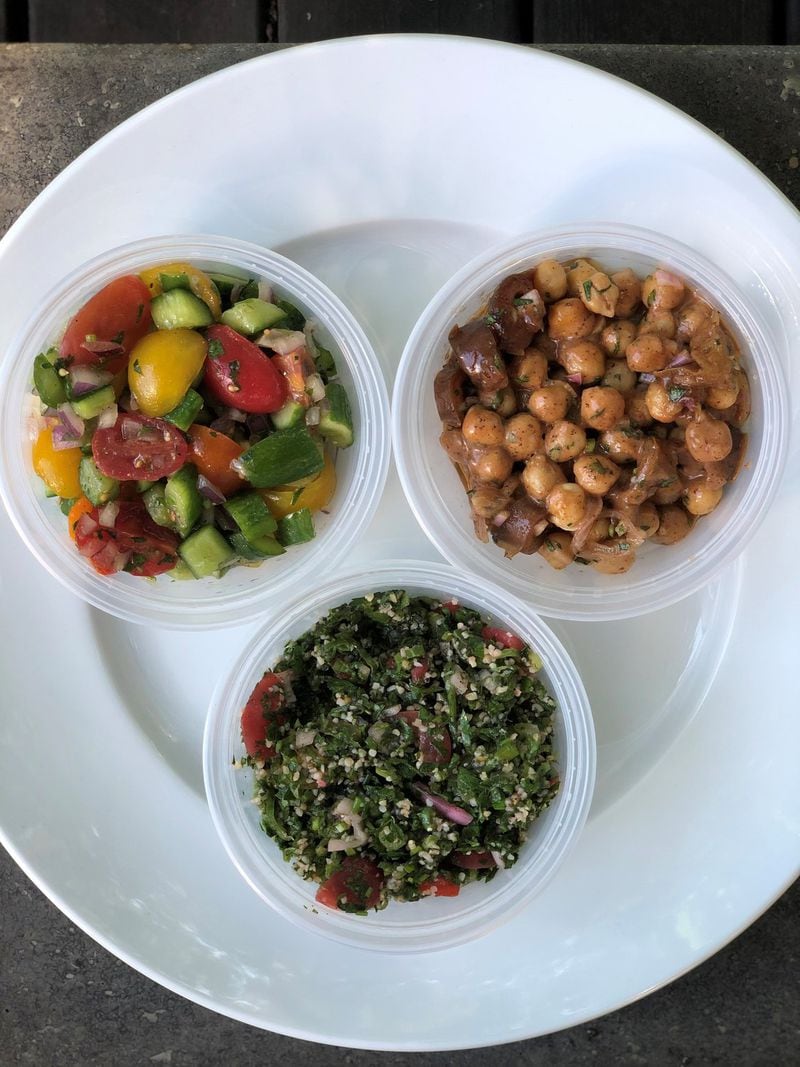 You can choose from six different mezzes at Rina. Shown here: Israeli salad, chickpea and date salad, and tabbouleh. CONTRIBUTED BY WENDELL BROCK