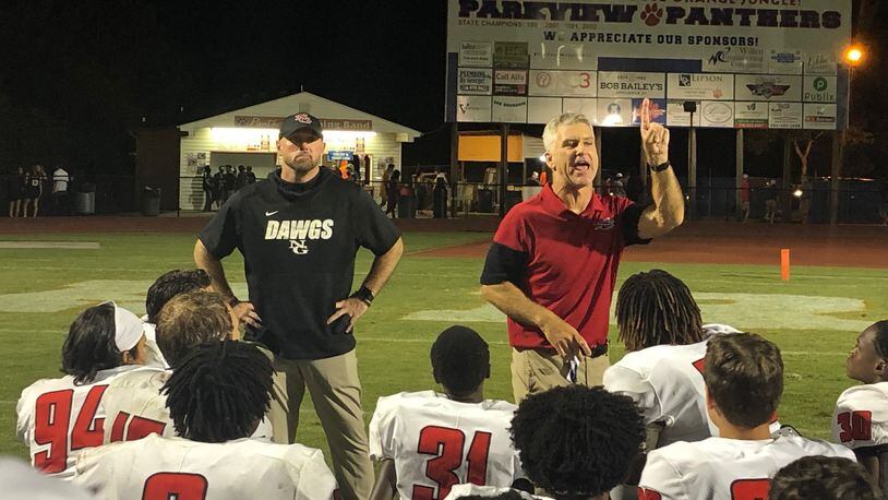 North Gwinnett coach Bill Stewart talks to his team after its 34-27 win over Parkview on Aug. 4, 2021.