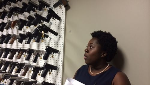 Candace Walker, the new director of the Atlanta Police Department forensic lab, in the gun room — which keeps a multitude of firearms to help with identifying what kind of weapon was used in a crime. (Steve Visser / svisser@ajc.com)