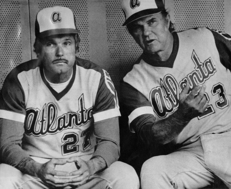 Ted Turner with pitching coach Johnny Sain in the dugout on May 11, 1977. 