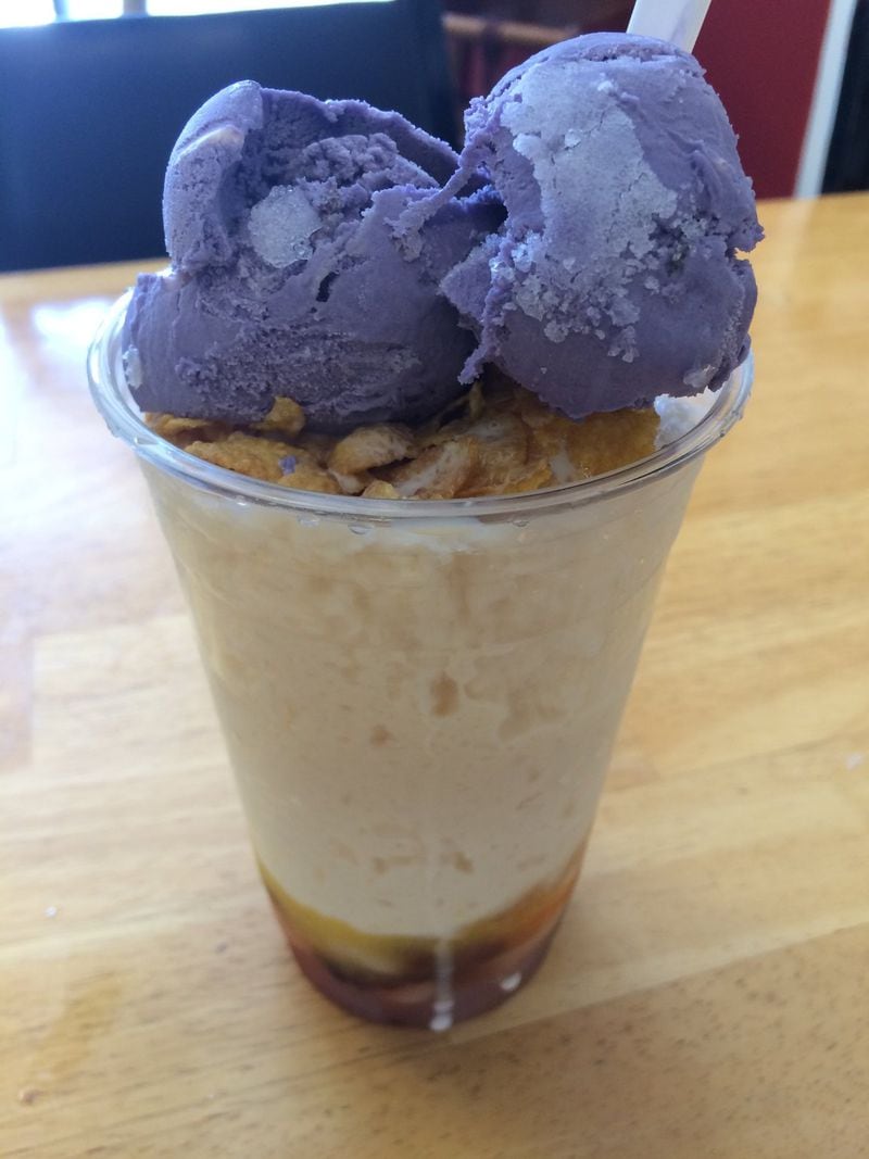 Halo-halo from Manila Mart is a Filipino dessert of shaved ice, evaporated milk, a variety of preserved fruits and boiled sweet beans, coconut flakes, crispy rice cereal and a couple of scoops of ube ice cream, whose bright color comes from purple yam. LIGAYA FIGUERAS / LFIGUERAS@AJC.COM