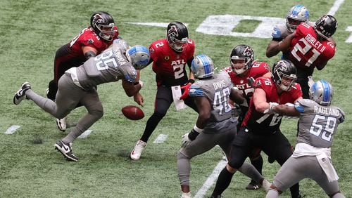 Detroit Lions defensive end Romeo Okwara (left) gets past Atlanta Falcons tackle Jake Matthews to strip sack quarterback Matt Ryan in the fourth quarter Sunday, Oct. 25, 2020, at Mercedes-Benz Stadium in Atlanta. The Lions recovered the ball, leading to a field goal to take a 16-14 lead. (Curtis Compton / Curtis.Compton@ajc.com)