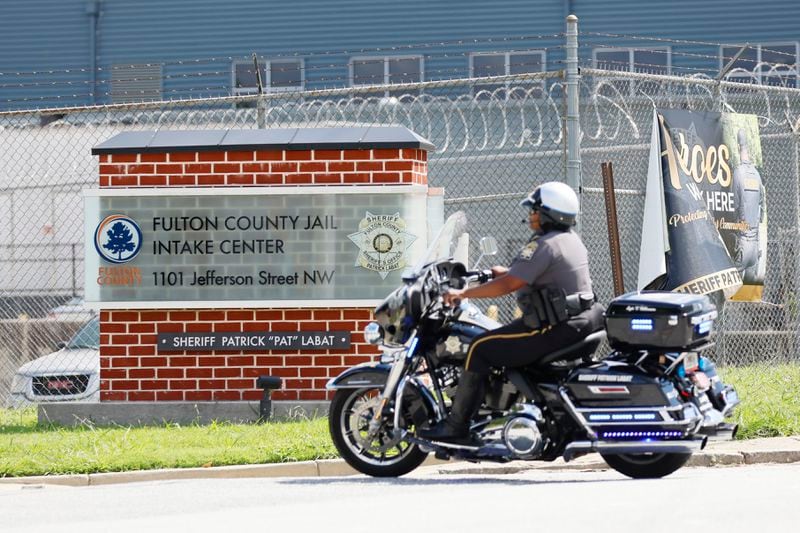 A police motorcycle is seen entering the Fulton County Jail in Atlanta on Thursday, August 16, 2023. Nineteen 19 individuals indicted by Fulton prosecutors, including former President, Donald Trump, must surrender to authorities here by Aug. 25. (Miguel Martinez /miguel.martinezjimenez@ajc.com)