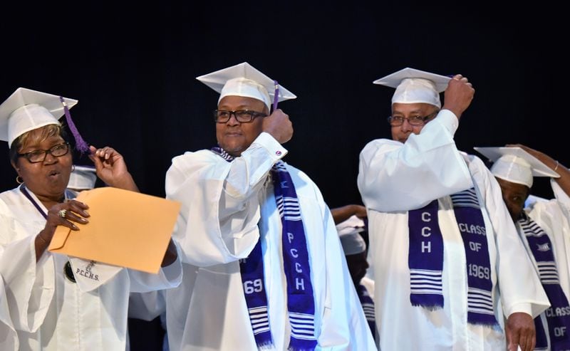Graduates from the Class of 1969 move their tassels from left to right during the graduation ceremony nearly 50 years after their last days of school at Pike County Consolidated High School, at the Pike County Auditorium in Zebulon on Saturday, March 3, 2018. Forty-nine years ago, the students at Pike County Consolidated High School, an all-black institution, emptied into the street to protest the way desegregation was being handled in their community. By way of punishment, the entire Class of 1969 was barred from graduation. This Saturday, graduates finally received their diplomas. HYOSUB SHIN / HSHIN@AJC.COM