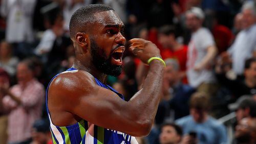 Tim Hardaway Jr. of the Atlanta Hawks reacts after Mike Dunleavy 3-point basket against the Boston Celtics at Philips Arena on January 13, 2017 in Atlanta, Georgia. (Photo by Kevin C. Cox/Getty Images)