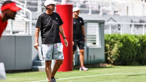 Georgia offensive coordinator and quarterbacks coach Todd Monken surveys the Bulldogs' offense from the West End zone of Sanford Stadium during the Bulldogs’ preseason practice session on Tuesday, Aug. 10, 2021. (Photo by Tony Walsh/UGA Athletics)