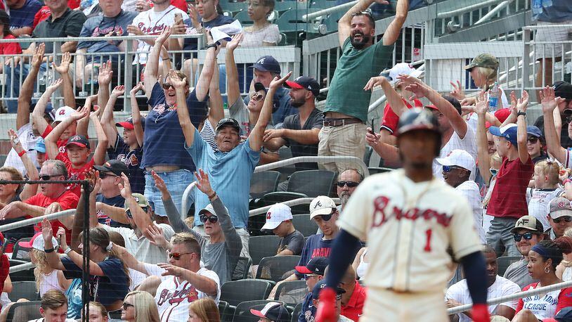 Braves fans start the wave after Ozzie Albies (foreground) draws a walk during the fifth inning Sunday, Aug. 8, 2021, against the Washington Nationals at Truist Park in Atlanta. (Curtis Compton / Curtis.Compton@ajc.com)