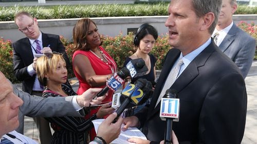 John Horn addresses the news media in September as U.S. Attorney after Adam L. Smith pleaded guilty to accepting more than 30,000 in bribes. Curtis Compton/ccompton@ajc.com