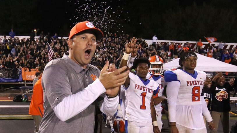 Parkview coach Eric Godfree celebrates Friday's 31-2 win over Brookwood. Also shown are Malik Washington (1) and Bryce Wilson (8). (Jason Getz/Special)