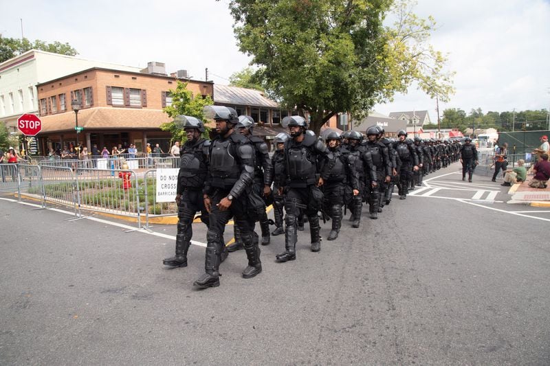 Police march into the Dahlonega square before the start of a pro-Trump rally Saturday in Dahlonega, on  September 14, 2019.  STEVE SCHAEFER / SPECIAL TO THE AJC