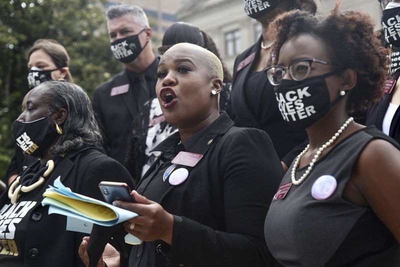 June 14, 2020 -  Atlanta -  Rep. Erica Thomas (left), D - Austell, speaks as she joined with members of the Georgia Democratic caucus on the steps of the Capitol.   On the Capitol stepsThe NAACP March to the Capitol coincided with the restart of the Georgia 2020 General Assembly.  Lawmakers returned wearing masks and followed new rules to restart the session during the pandemic.   Steve Schaefer for the Atlanta Journal Constitution