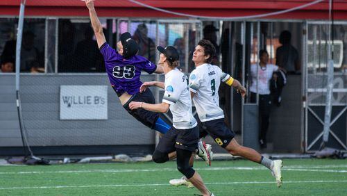Atlanta Hustle team member Jeremy Langdon attempts a leaping catch in an April 30, 2022 game against the Tampa Bay Cannons at Silverbacks Park. (Ryan Cameron/AUDL)