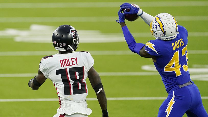 Los Angeles Chargers cornerback Michael Davis (43) intercepts a pass intended for Atlanta Falcons wide receiver Calvin Ridley (18) during the second half Sunday, Dec. 13, 2020, in Inglewood, Calif. (Ashley Landis/AP)