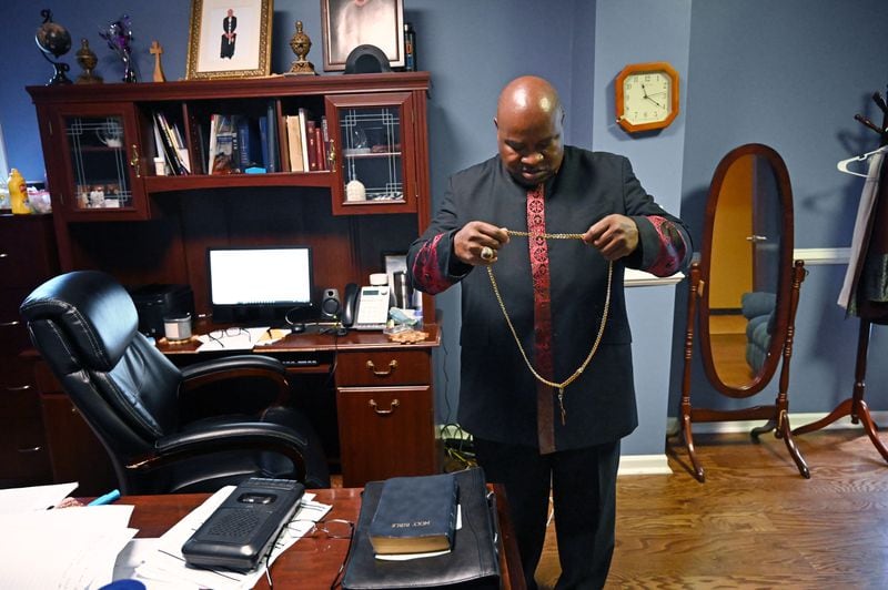 Bishop Melvin McCluster, in his office at Friendship Missionary Baptist Church in Americus, now preaches his Sunday sermon on Facebook, after closing the church because of the pandemic. He misses seeing the faces of his congregation as he speaks to them, but he and parishioners don't want to risk returning, after entire families got infected and four members were lost to COVID-19. (Hyosub Shin / Hyosub.Shin@ajc.com)
