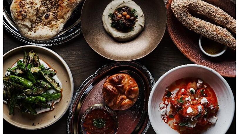 A look at some featured menu items including Zaatar Laffa, Hummus No. 1, Jerusalem bagel, Okra, Kubaneh, and Watermelon at Aziza.