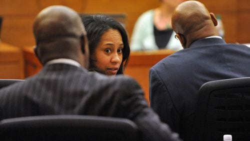 Prosecutor Fani Willis turns to talk with Fulton County DA Paul Howard during witness statements. Sentencing of 10 of the 11 defendants convicted of racketeering and other charges in the Atlanta Public Schools test-cheating trial before Judge Jerry Baxter in Fulton County Superior Court, Monday April 13 2015. (Atlanta Journal-Constitution, Kent D. Johnson, Pool)