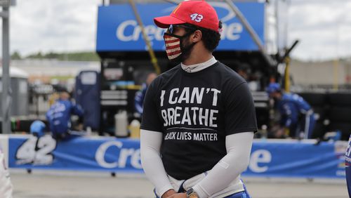 Driver Bubba Wallace wears a "I Can't Breath, Black Lives Matter" shirt before NASCAR race Sunday, June 7, 2020,at Atlanta Motor Speedway in Hampton, Ga. Wallace, the only full-time black driver in any of NASCAR’s top three series, encouraged his peers to speak up about racial injustice.