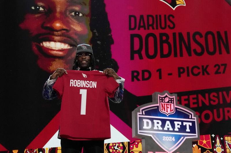 Missouri defensive lineman Darius Robinson poses after being chosen by the Arizona Cardinals with the 27th overall pick during the first round of the NFL football draft, Thursday, April 25, 2024, in Detroit. (AP Photo/Jeff Roberson)
