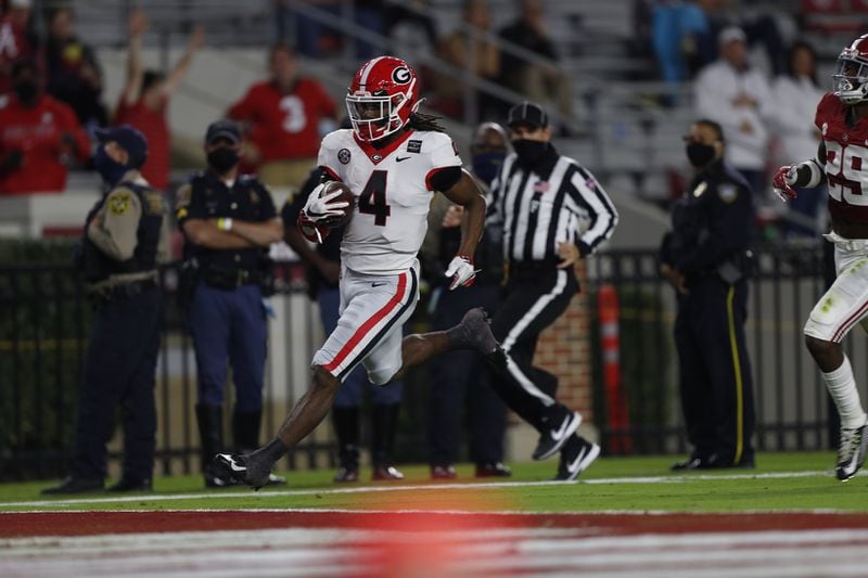 Georgia running back James Cook (4) reached the end zone for a score against the Crimson Tide Saturday, Oct. 17, 2020, in Tuscaloosa, Ala.. (Skylar Lien)