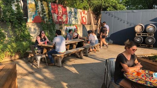 With an X marked out for social distancing, people enjoy a beer and snacks after walking the BeltLine at Wild Heaven Beer West End. 
Courtesy of Wild Heaven Beer