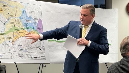Greg Teague, the CEO of Croy Engineering, points to a map of the proposed Hanson Spur that the Sandersville Railroad Company is seeking to build during a hearing at the Georgia Public Service Commission.