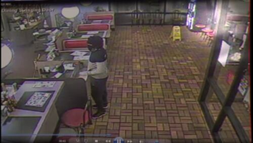 Surveillance photo shows a man wanted in connection with DeKalb County robberies. (Credit: Channel 2 Action News)
