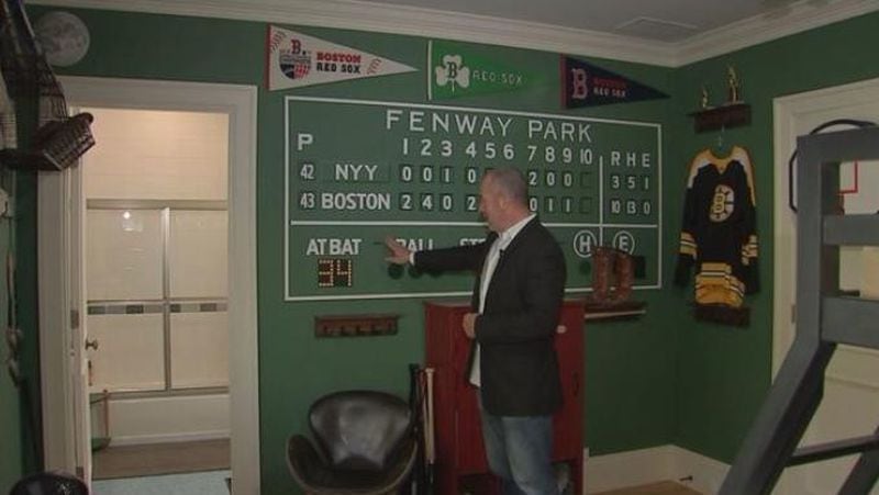 One bedroom is a mock-up of Fenway Park, complete with the Green Monster on the wall.