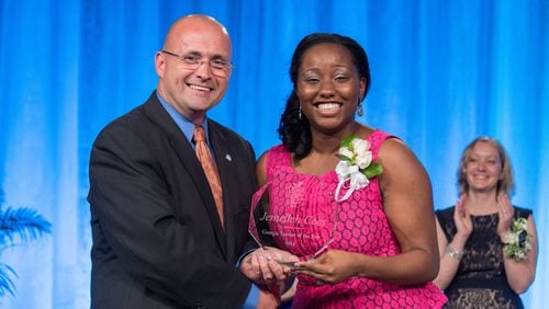 Dr. John Barge names Jemelleh Coes Georgia Teacher of the Year in 2014. (DOE)