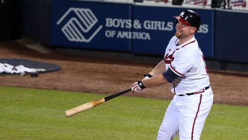 Atlanta Braves catcher Brian McCann (16) watches his long fly ball caught for an out during the 4th inning during the first game of the National League Division series between the Los Angeles Dodgers and Atlanta Braves at Turner Field, Thursday, October 3, 2013.