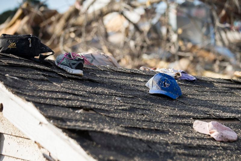 Personal items sit atop a roof the was ripped apart in a local residence in Talbotton, Monday, March  4, 2019. Keith Stellman, head forecaster for the National Weather Service, said during the presser that the path of destruction in the town looked to be caused by an EF2 tornado, although that wasn't confirmed during the governor's tour.  (ALYSSA POINTER/ALYSSA.POINTER@AJC.COM)